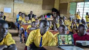 Students watch a movie about coexisting apes.