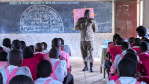 Chief Warden Tibesigwa speaks with students