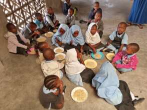 Children enjoying the feeding program
