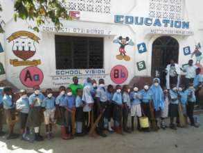 Providing books, desks & food to 300 slums kids.