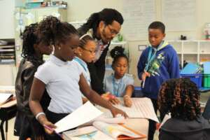 Bomani with students