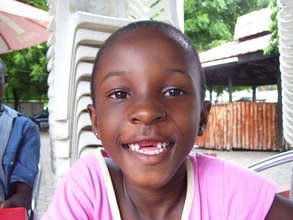 A happy one within  smiles at the Camera