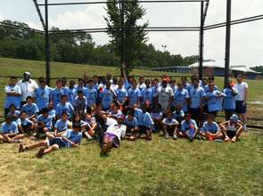 Soccer camp coaches, alumni volunteers and campers