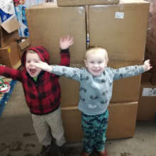 Tiny helpers with boxes of Aussie Nappies!