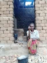 Woman  showing her kitchen.