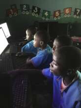 Kids using the computer in the computer lab
