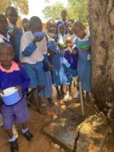 School children drinking from a handpump