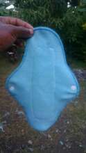 Sample sanitary pad made using an electric sewing