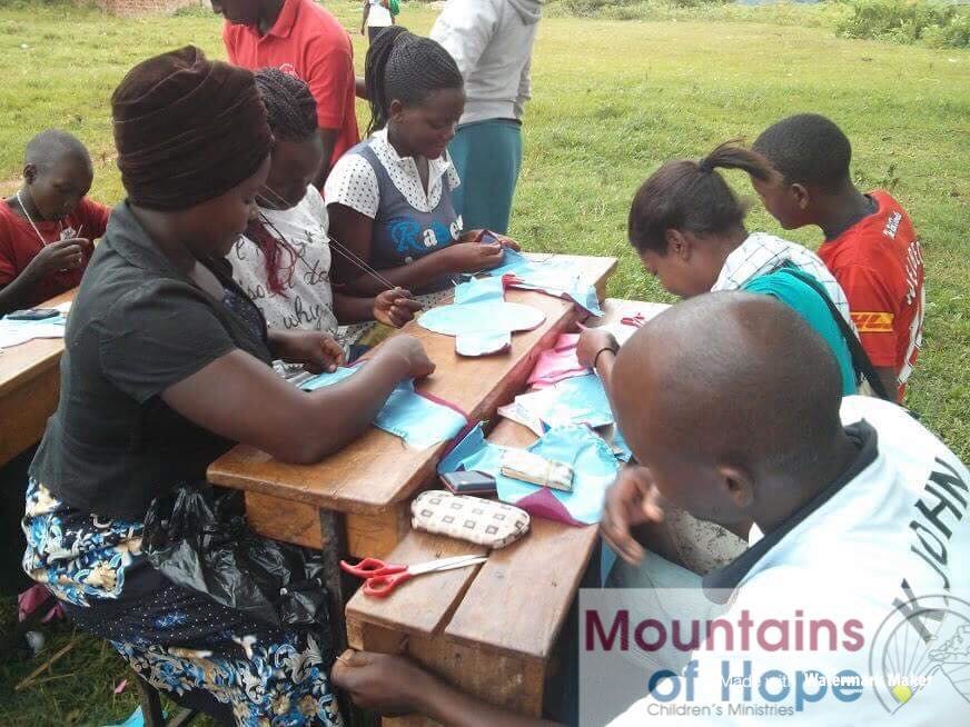 Train 700 girls to sew sanitary pads&face masks