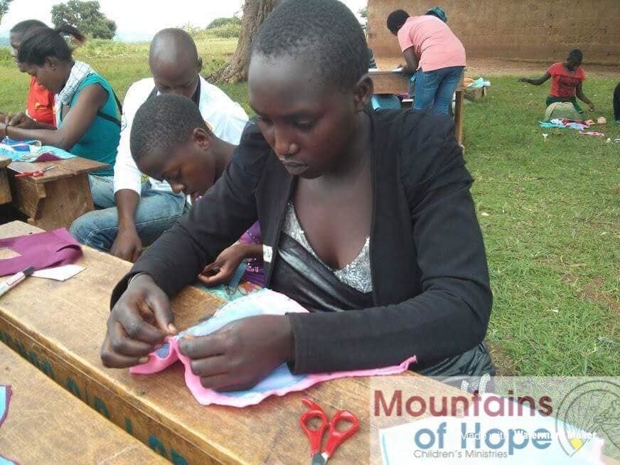 Train 700 girls to sew sanitary pads&face masks