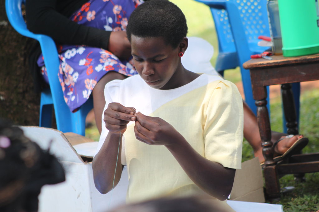 Train 700 girls to sew sanitary pads&face masks