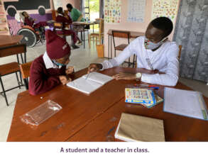 A student and a teacher in class.