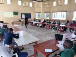 WE REACH staff engaging the participants on WASH