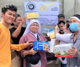 People receiving much needed food at AAI event