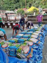 Stacking rice for AAI Relief event