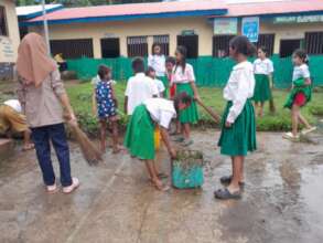 Teachers, students and volunteers work together