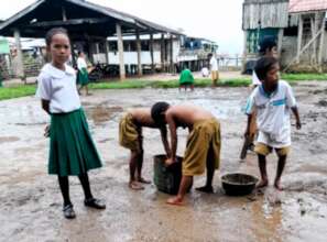 Students clean up schoolgrounds after storm