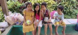 Children sharing a meal during an outreach event