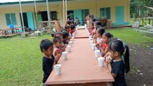 Children gather for their school lunch