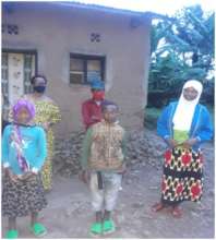 Gasana back with his little children and Solange.