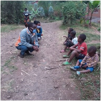 Picture 7 - Teacher listening to children.