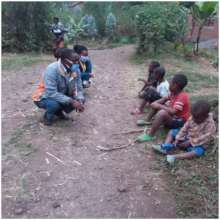 Picture 7 - Teacher listening to children.