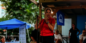 Esther sharing her journey at a PRoTechos event.