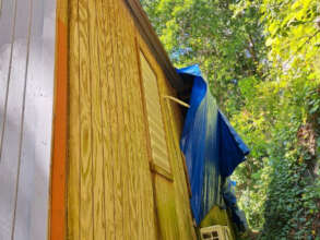 Tattered tarps were the only cover after storms.