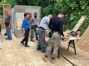 Apprentices learn skills while rebuilding a home.