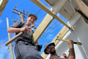 Apprentices at work on the new roof frame