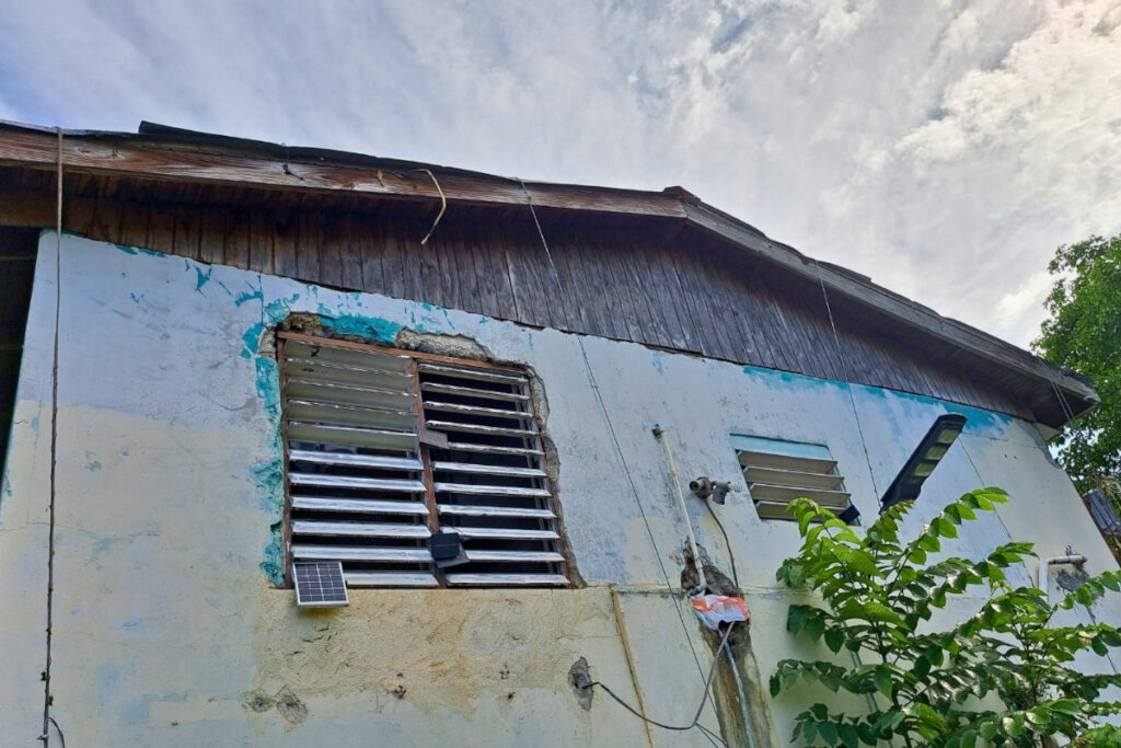 Damaged roof and exterior wall