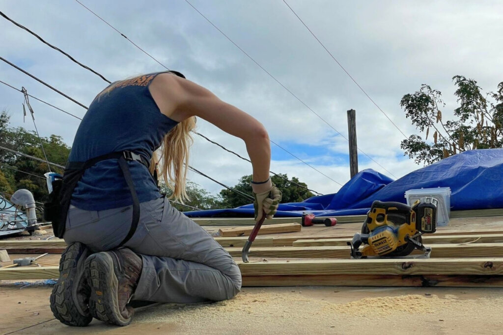 Team member securing lumber for the new frame