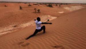 Trainer Aliou performing in Momentum