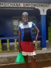 a girl collecting menstrual kit from our office