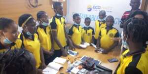 Students listening to information on power supply