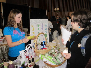 Students educating peers at a community event