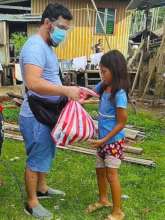 Girl receives care package from AAI volunteer
