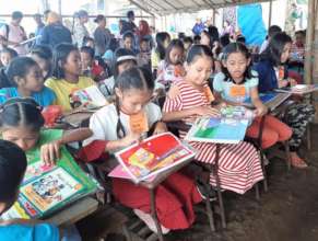 Girls gathered reading together