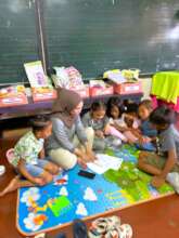 Children work in a group with teacher