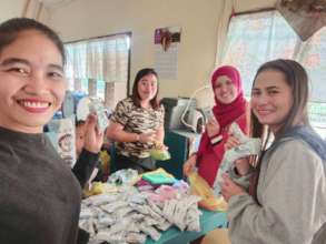 AAI female volunteers pack relief supplies, Jolo