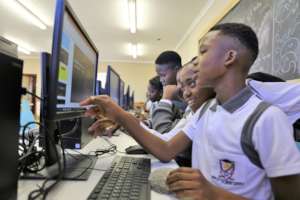 Students team up to learn coding.
