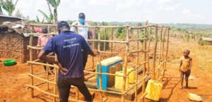 Local Uganda PW staff monitor water supply station
