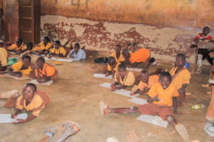 School children without furniture in Tolon