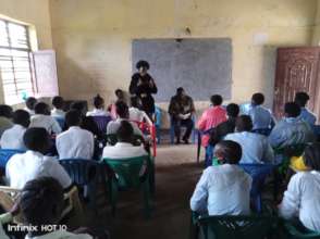 Abuk talks to Students, Akur & Daniel wait