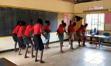 Students performing Acholi traditional dance