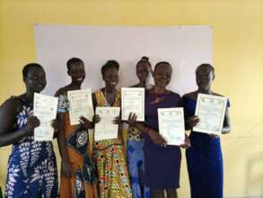 Computer Class graduates show certificates