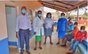Eunice (center) with colleagues at the dispensary