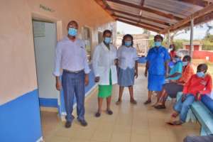 Eunice (center) with colleagues at the dispensary
