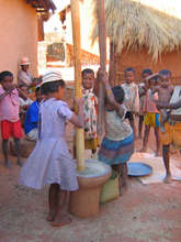 Children pounding rice in Madagascar
