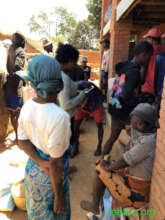 Waiting in line at the their rice-bank
